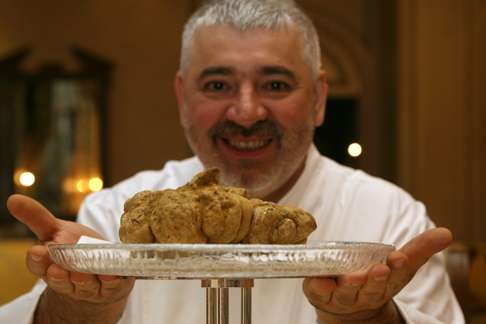 Chef Umberto Bombana with a 750g white truffle at the Ritz-Carlton in Central in 2007. Photo: Oliver Tsang