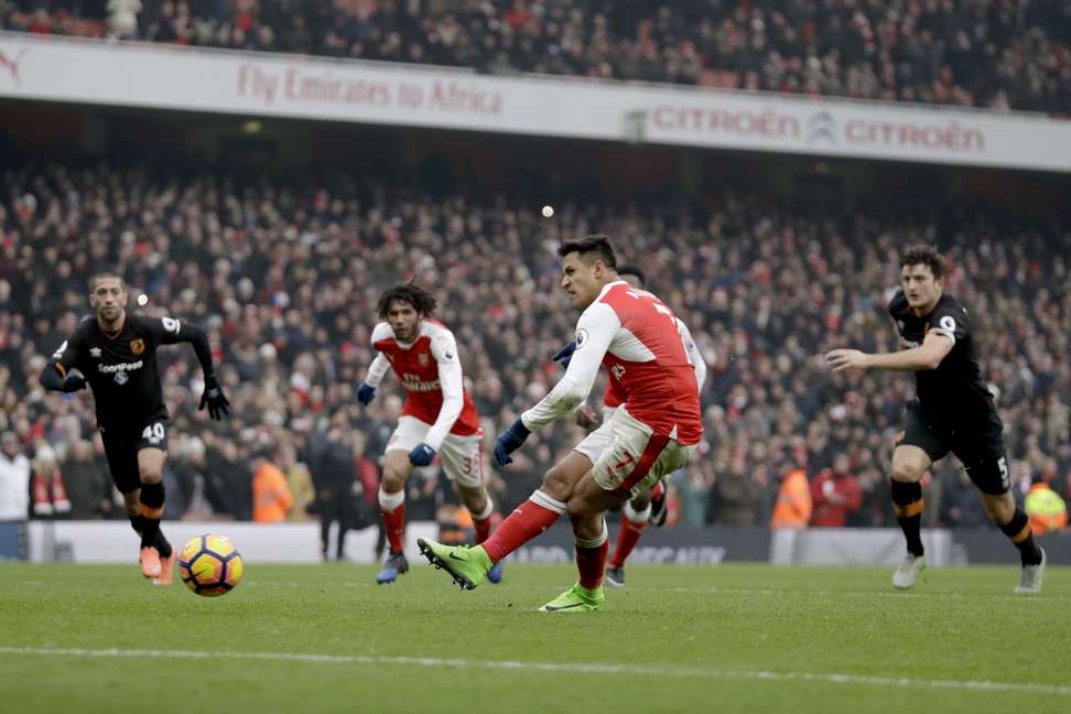 Arsenal's Alexis Sanchez scores against Hull City at the Emirates Stadium in London. Photo: AP
