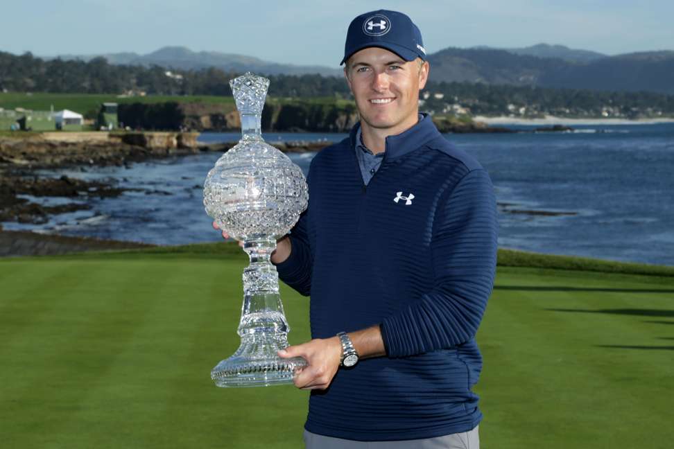 Jordan Spieth poses with the trophy after winning the AT&T Pebble Beach Pro-Am. Photo: AFP