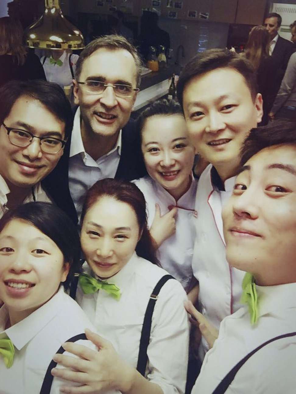 Jerome Laurent, corporate chef for Aden Services, with co-workers in Shanghai.