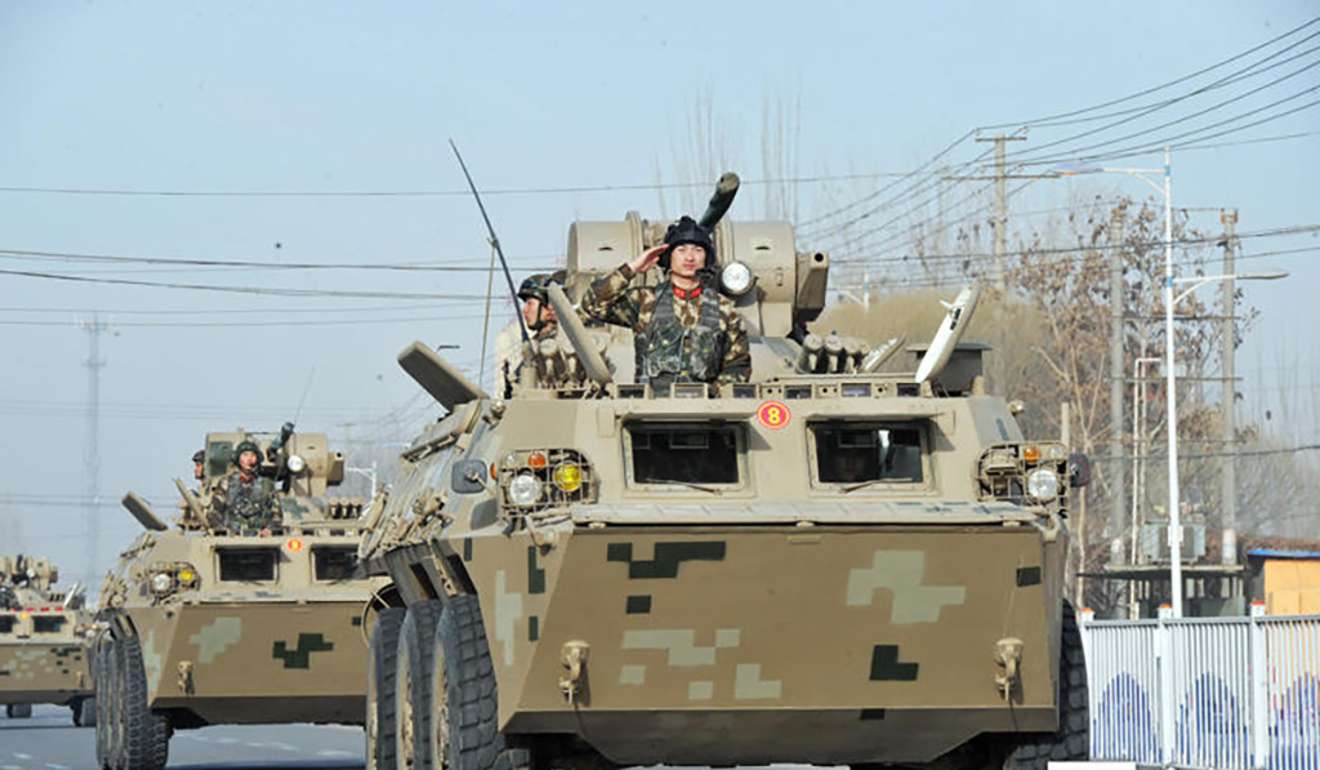 An armoured vehicle taking part in the Hotan parade. Photo: Ts.cn
