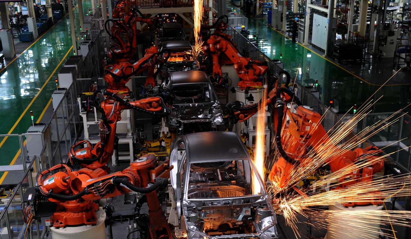 Robotic arms busy working on the assembly line in Geely Auto Ningbo factory in Ningbo: Xinhua