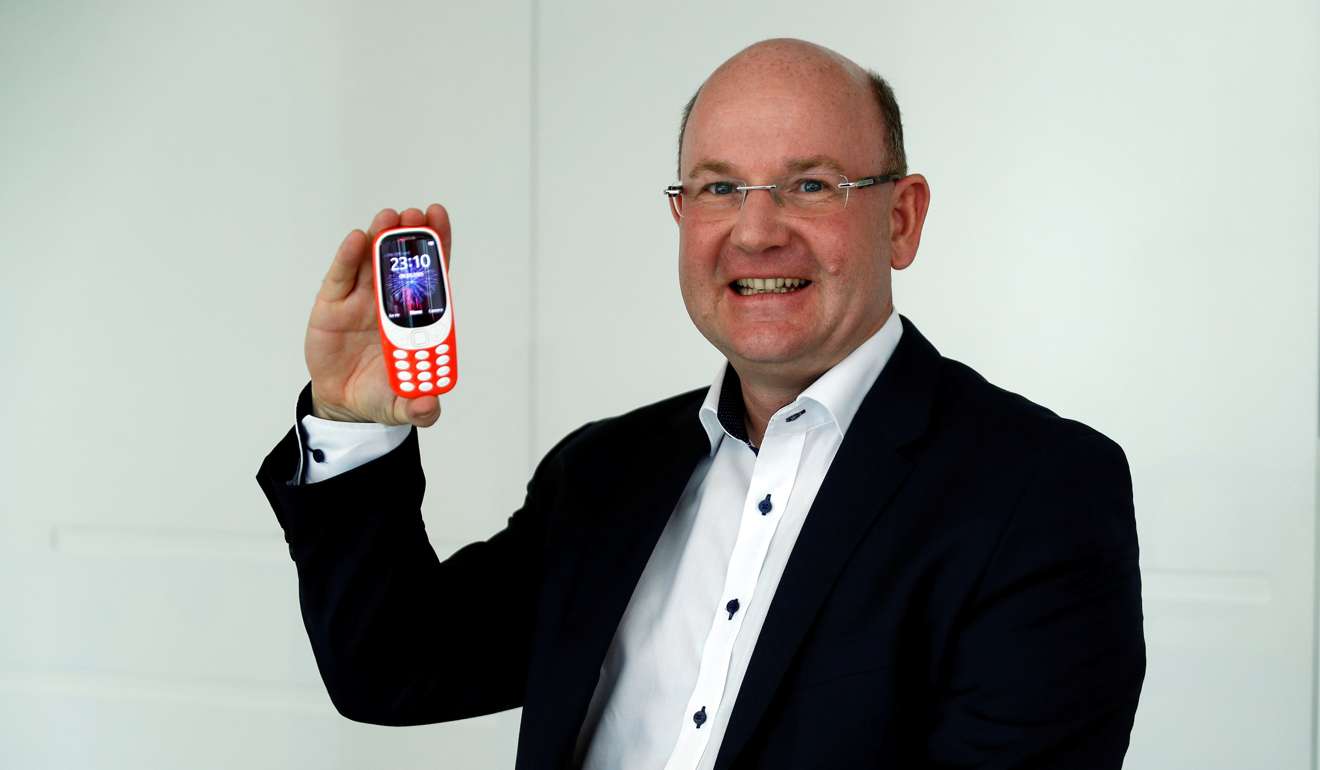 HMD Global President Florian Seiche poses for a photograph with the Nokia 3310 in London,. Photo: Reuters