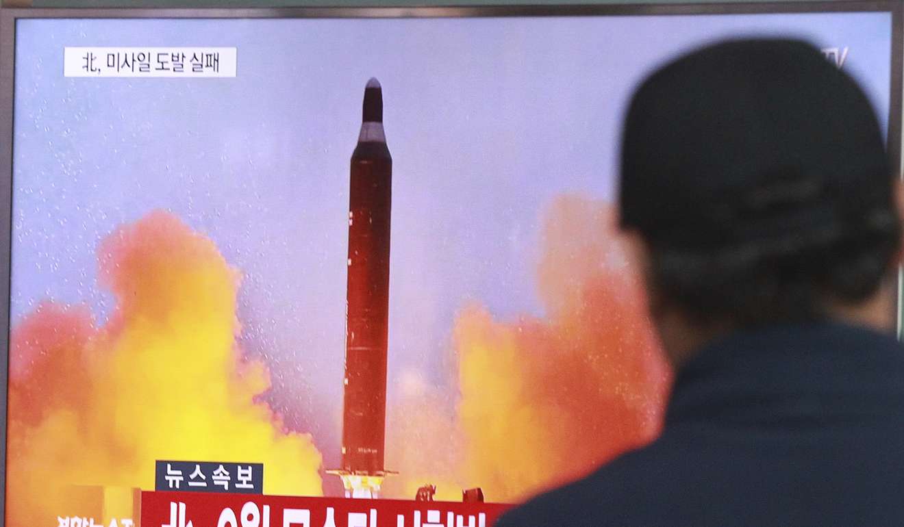 A man watches a TV news programme showing a file image of a missile launch conducted by North Korea, at the Seoul Railway Station in Seoul, South Korea. Photo: AP