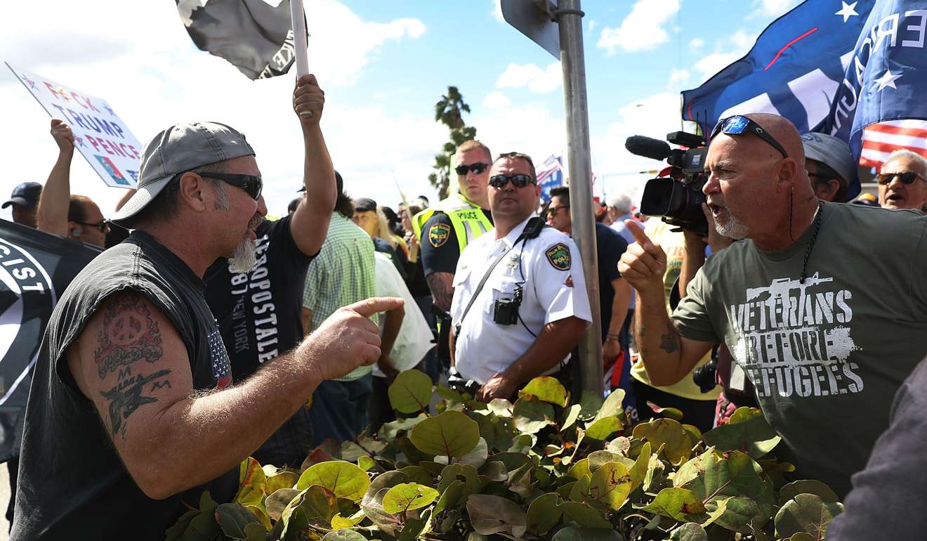 John Pope (L) expresses his disagreement with supporters of US President Donald Trump near the Mar-a-Lago resort in West Palm Beach, Florida. Photo: AFP