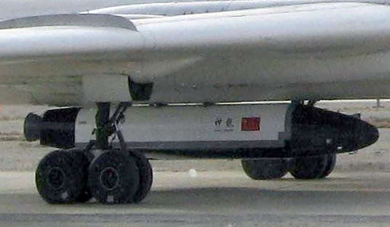 China's mystery space plane Shen Long is seen being carried under a Chinese bomber in 2007. Photo: SCMP Pictures