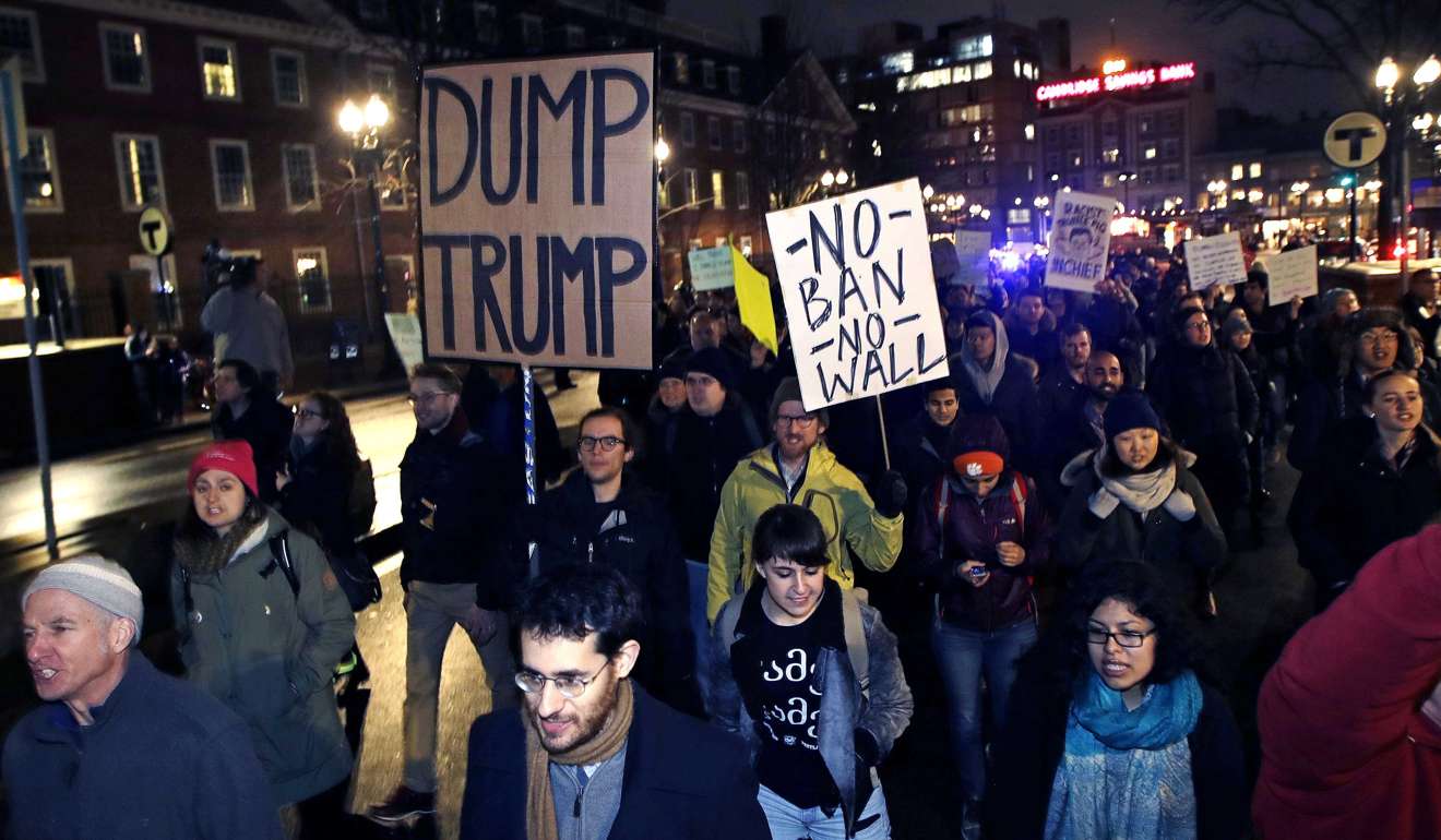 Hundreds of protesters march against the revised US travel ban, in Cambridge, Massachusetts, on March 7. President Donald Trump’s revised order blocks people from six Muslim-majority nations from obtaining US visas for at least 90 days, and suspends the refugee resettlement process for 120 days. Photo: AP