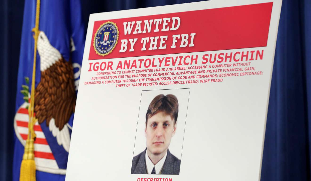 A poster of suspected Russian hacker Igor Sushchin is seen shown in the FBI National Security Division and the US Attorney's Office for the Northern District of California joint news conference at the Justice Department in Washington. Photo: Reuters