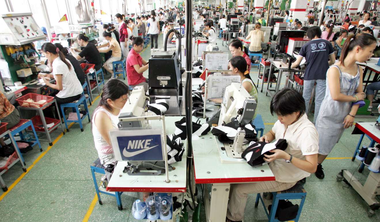 Factory workers make Nike shoes at a factory in Dongguan, Guangdong province. CCTV accused the US sports brand of misleading advertising. Photo: ImagineChina
