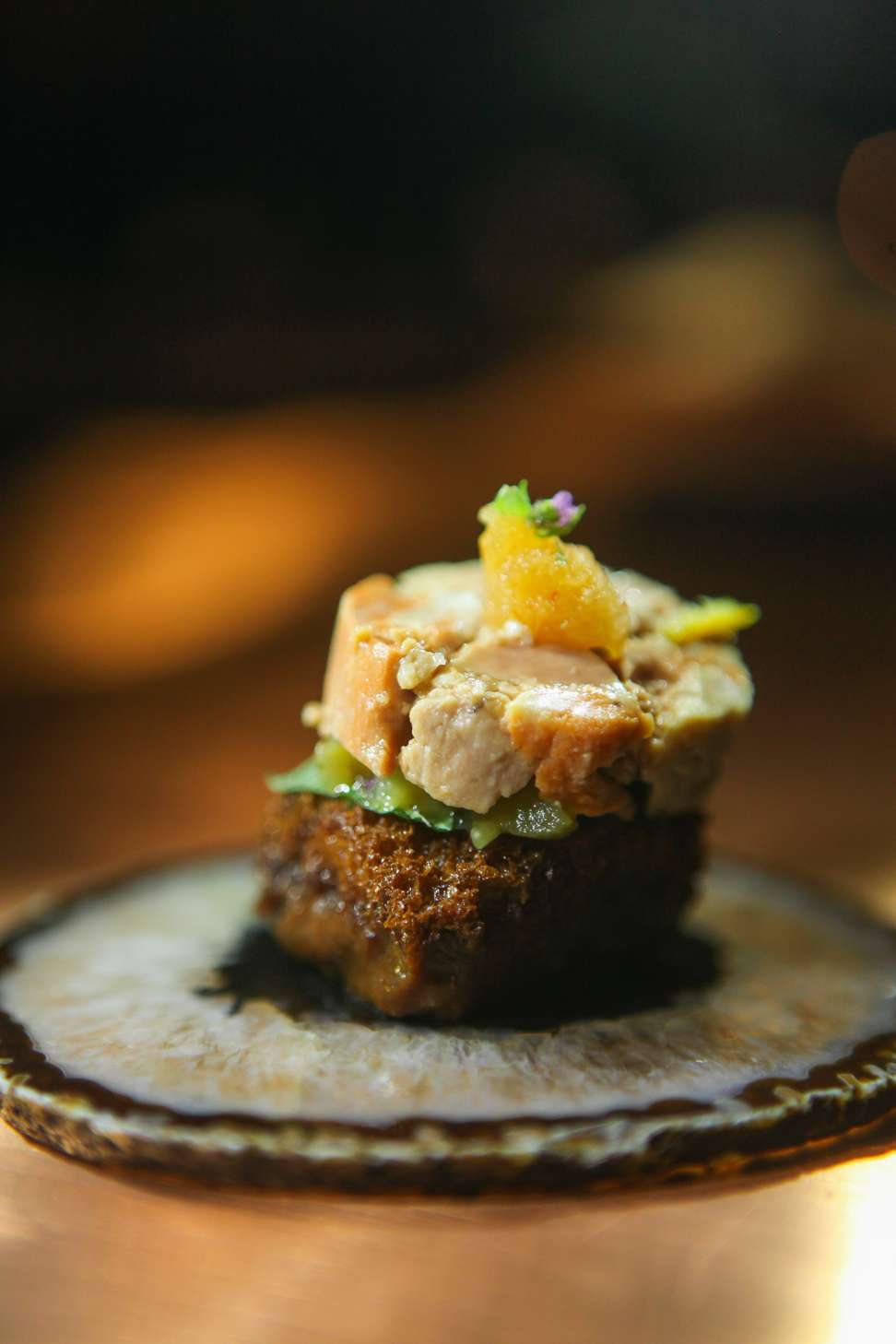 Monkfish liver and pickled eggplant on bread soaked in miso and yuzu from Mecha Uma. Photo: Harvey Tapan