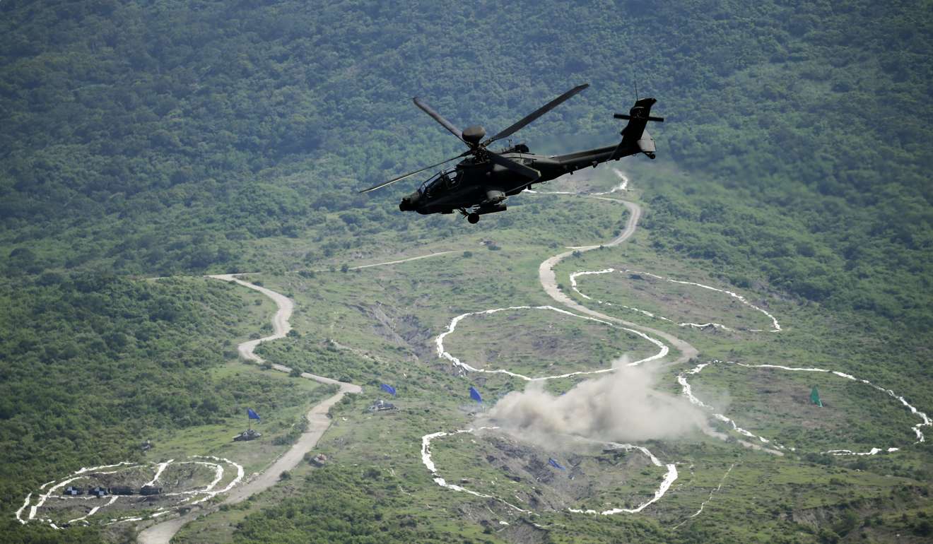 A Taiwanese AH-64E Apache attack helicopter fires a missile during the Han Kuang (Chinese Glory) 32nd military exercise in Pingtung county, Taiwan, in August 2016. Photo: EPA