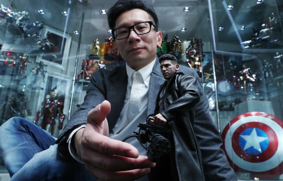 Hot Toys founder Howard Chan displays some of his products at Secret Base in Mong Kok. Photo: Edward Wong