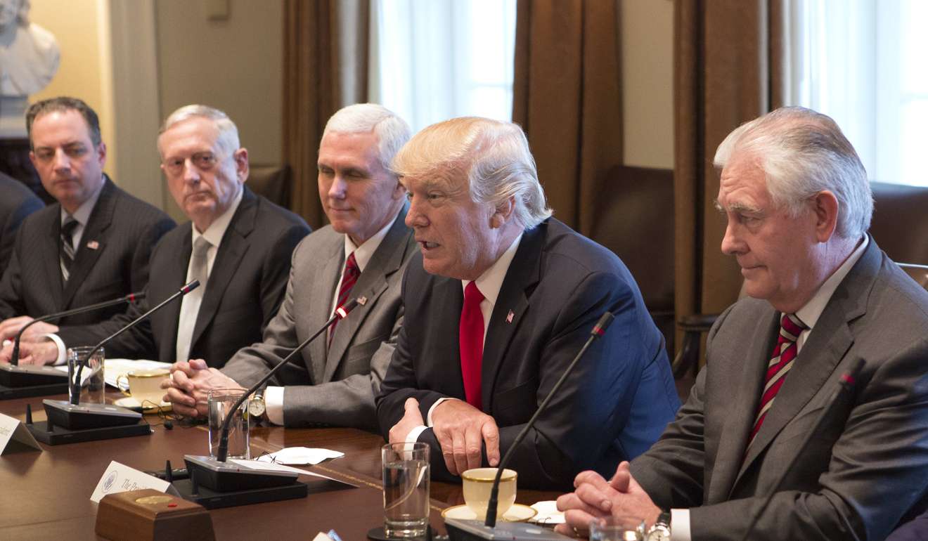 US President Donald Trump, flanked by Vice-President Mike Pence (third left) and Secretary of State Rex Tillerson, and other cabinet members, at a meeting with Prime Minister Haider al-Abadi of Iraq (not pictured), in the White House on March 20. Photo: EPA
