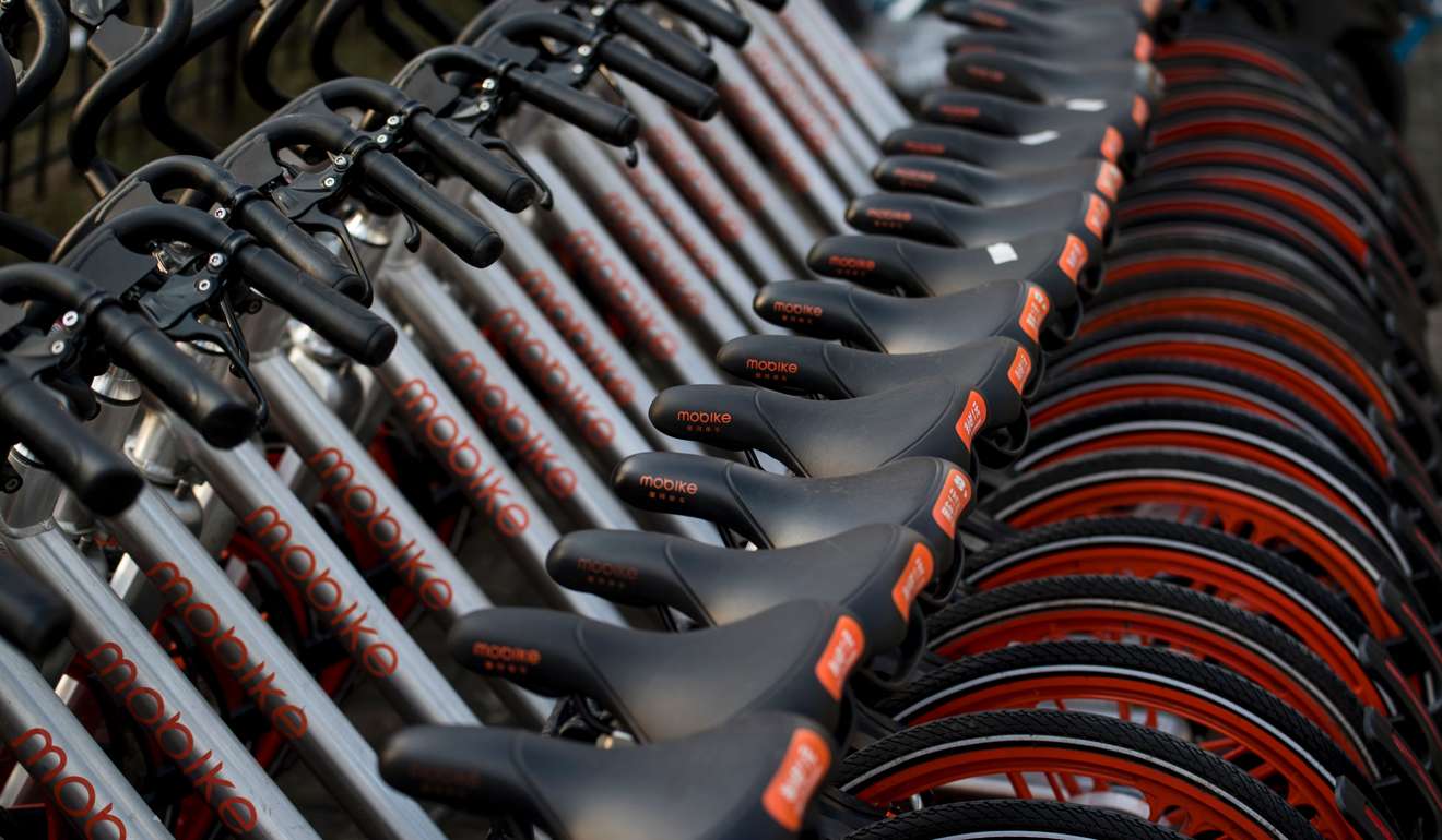 Bicycles belonging to the Mobike sharing company in Shanghai. Open the Mobike app on your phone, scan the QR code on the bike, and you’re away! Photo: AFP