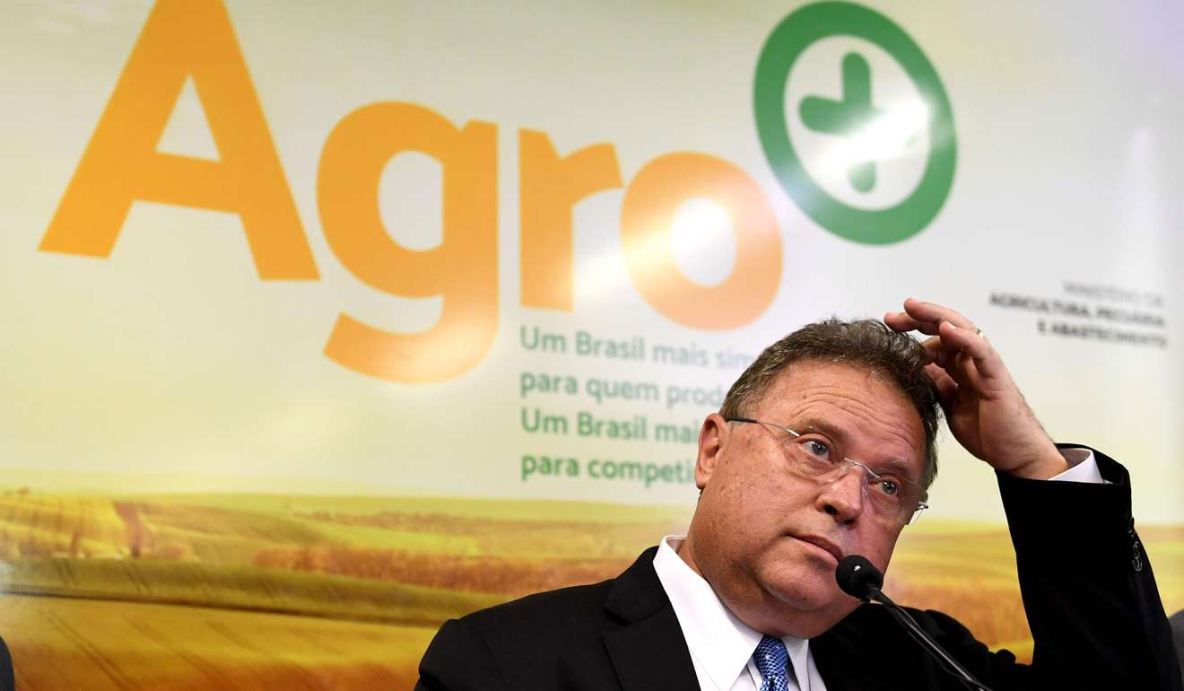 Brazilian Agriculture Minister Blairo Maggi speaks during a press conference at the Agriculture Ministry in Brasilia. Brazil, the world's top beef and poultry exporter, has been rocked by accusations that the meat processing plants used chemicals to hide the smell of rotting meat and bribed health inspectors to pass off their products as safe. Photo: AFP