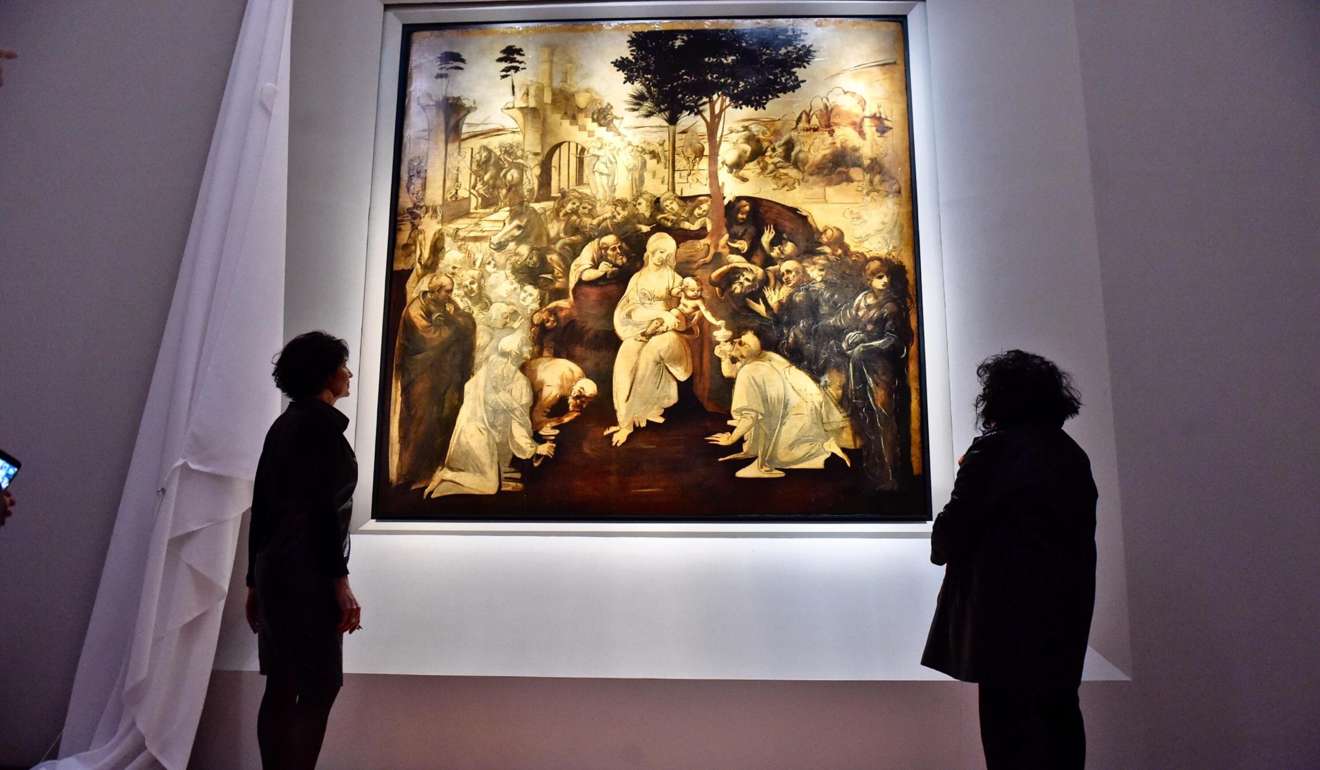 Visitors look at a recently restored artwork by Leonardo da Vinci, the “Adoration of the Magi”, at the Uffizi Gallery in Florence, Italy. Will the day come when students can learn how to draw from a Leonardo da Vinci avatar? Photo: EPA