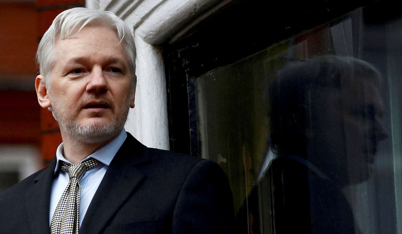 WikiLeaks founder Julian Assange makes a speech from the balcony of the Ecuadorian Embassy, in central London. Photo: Reuters