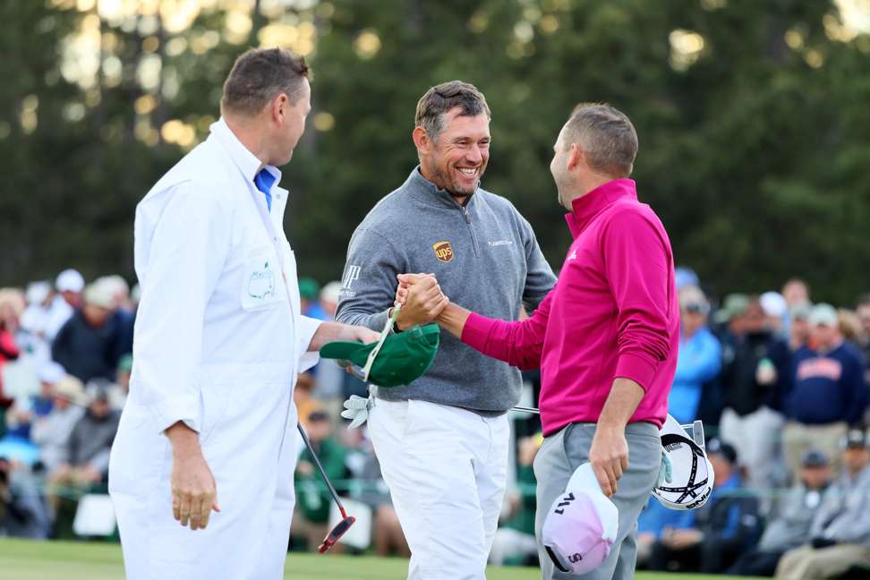 Lee Westwood and Sergio Garcia react on the 18th green. Photo: AFP