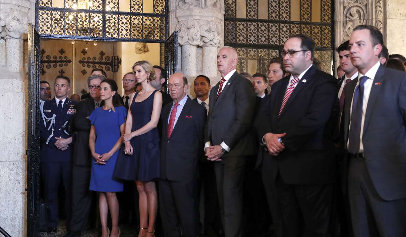 Ivanka Trump, the daughter and assistant to President Donald Trump (third from left) stands next to Commerce Secretary Wilbur Ross as President Donald Trump speaks at his Mar-a-Lago retreat on Thursday. Photo: AP