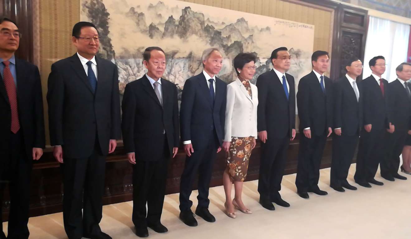 Carrie Lam with Premier Li Keqiang (fifth from right) and other officials in Beijing. Photo: Handout
