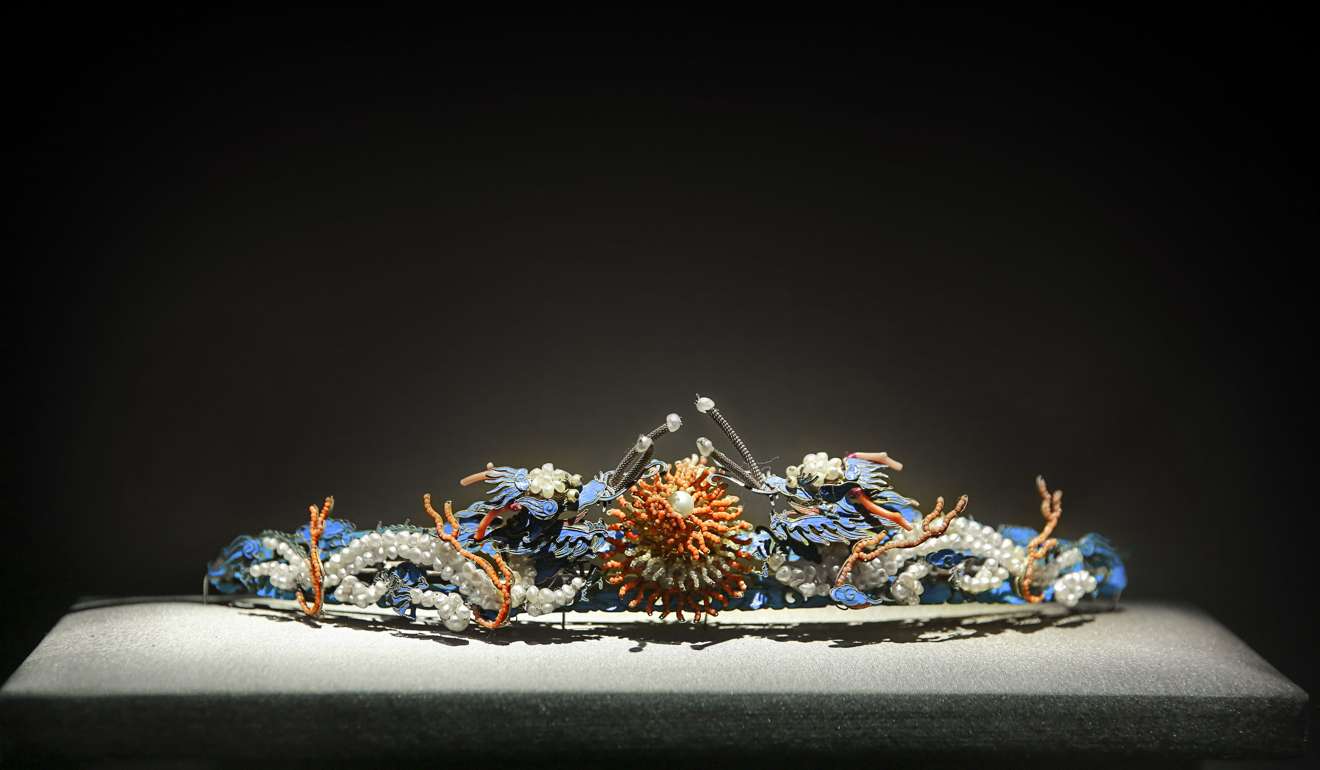 The Palace Museum’s “Hair pin with two dragon motifs” dates to the Qing Dynasty and features gilded and coloured silver, glass pearls, coral and pearls