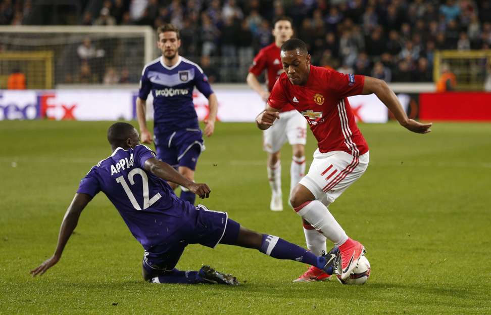 Anderlecht's Dennis Appiah (left) in action with Manchester United's Anthony Martial. Photo Reuters