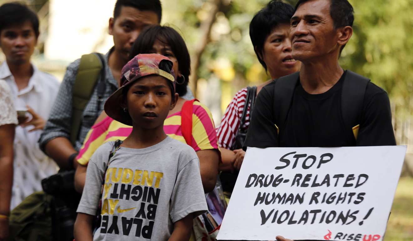 A placard held by a demonstrator makes the sentiment clear during a “Rise Up!” public forum at a church in Manila on March 1. Rise Up! is a campaign initiated by different faith-based institutions and people’s organisations to document cases of drug-related killings, and to advocate the protection of human rights against drug-related extrajudicial killings. Photo: EPA
