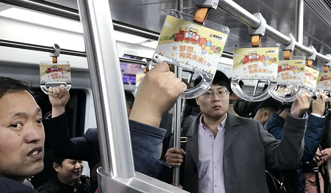 Passengers take a train ride of the subway Line 7 in Beijing. Photo: Simon Song