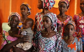 One of the 21 Chibok school girls released by Boko Haram carries her baby during their visit to meet President Muhammadu Buhari last month. Photo: Reuters