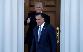 US President-elect Donald Trump gestures as former Massachusetts governor Mitt Romney exits their meeting at the main clubhouse at Trump National Golf Club. Photo: Reuters