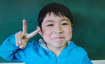 This undated handout picture provided by an elementary school of Hokuto city shows Yamato Tanooka. The seven-year-old boy, missing in a forest in northern Japan since last Saturday, was found alive on Friday. Photo: AFP