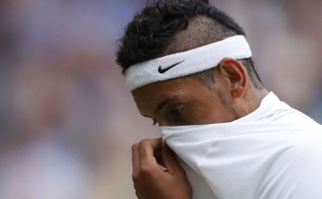 Australia's Nick Kyrgios fights his demons in a limp defeat to Andy Murray in the fourth round at Wimbledon. Photo: Reuters