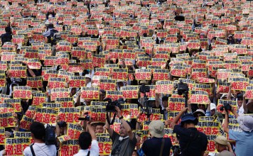 Protesters in Naha, Okinawa, rally last month against the US military presence in Okinawa, as they have done since 1995. Photo: Xinhua