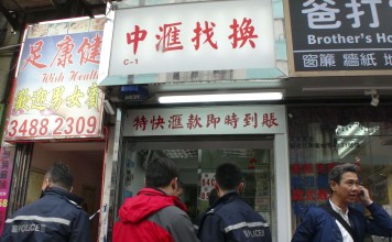 Police investigate the death of the money changer in Tai Po. Photo: SCMP Pictures