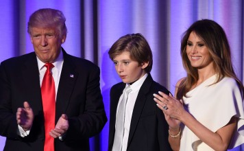 US President-elect Donald Trump arrives with his son Barron and wife Melania at the New York Hilton Midtown in New York in the early hours of November 9. Melania and Barron will stay in New York when the president-elect moves into the White House, the transition team has confirmed. Photo: AFP