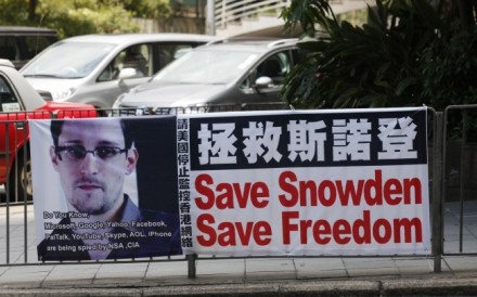 A banner supporting Edward Snowden is displayed at Central, Hong Kong's business district. Photo: AP