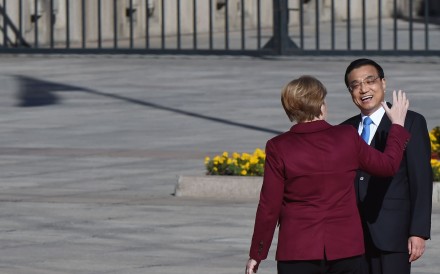 German Chancellor Angela Merkel chats with Chinese Premier Li Keqiang during a welcome ceremony outside the Great Hall of the People in Beijing on Thursday. Photo: AFP German Chancellor Angela Merkel chats with Chinese Premier Li Keqiang during a welcome ceremony outside the Great Hall of the People in Beijing on Thursday. Photo: AFP
