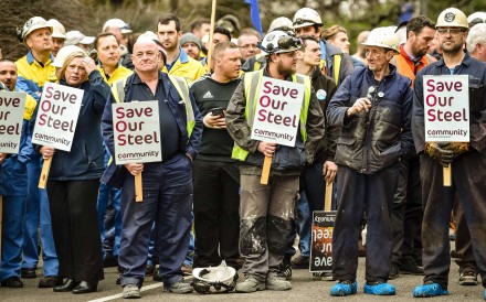 Workers at Tata Steel’s plant in Port Talbot, Wales, wait for news on a meeting to try and save their jobs. Tata is selling its loss-making steel operations in Britain. Rightly or wrongly, this has been blamed on cheap Chinese steel. Photo: AFP