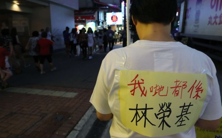 A member of Hong Kong’s Labour Party protests near Causeway Bay Books to support Lam Wing-kee, one of the five booksellers detained on the mainland. The sign he wears says “We’re all Lam Wing-kee”. Photo: Edward Wong