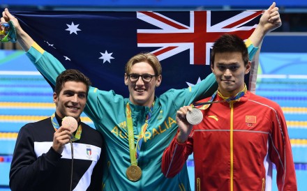 Gold medal winner Mack Horton of Australia celebrates with silver winner Sun Yang of China and Gabriele Detti of Italy. Photo: EPA
