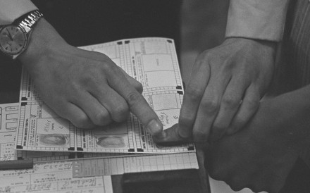 An applicant for a Hong Kong identity card undergoes fingerprinting in 1969. Picture: SCMP
