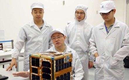 Researchers at Northwestern Polytechnical University and their “cubesat”, which was launched at the Hainan Satellite Launch Centre in June. Photo: Nwpu.edu.cn