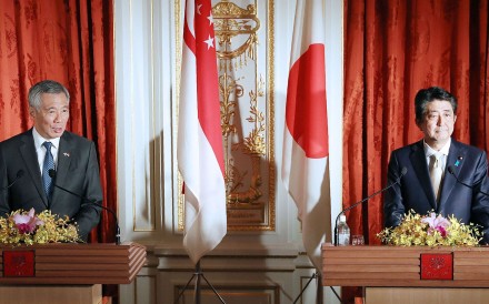 Prime Minister Shinzo Abe, right, and his Singaporean counterpart Lee Hsien Loong attend a joint press conference following their talks in Tokyo on Wednesday. Photo: Kyodo