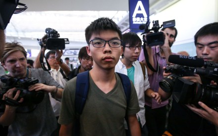 Activist Joshua Wong arrives at the Hong Kong International Airport after being detained by Thai authorities and denied entry to Thailand. Photo: Sam Tsang