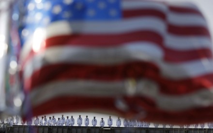 Sailors from the US Navy nuclear-powered aircraft carrier USS Ronald Reagan man the rails upon arrival in 2015 at the US Navy’s Yokosuka base, south of Tokyo, as US flag-shaped balloons are hoisted to welcome them. Photo: AP Sailors from the US Navy nuclear-powered aircraft carrier USS Ronald Reagan man the rails upon arrival in 2015 at the US Navy’s Yokosuka base, south of Tokyo, as US flag-shaped balloons are hoisted to welcome them. Photo: AP
