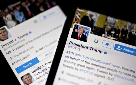 The Twitter Inc. accounts of U.S. President Donald Trump, @POTUS and @realDoanldTrump, are seen on an Apple Inc. iPhone. Photo: Andrew Harrer/Bloomberg