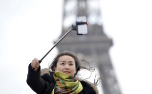 A tourist takes a selfie in front of the Eiffel Tower in Paris. The country’s tourism deficit soared to US$206 billion in the six months through June 30. Photo: AFP A tourist takes a selfie in front of the Eiffel Tower in Paris. The country’s tourism deficit soared to US$206 billion in the six months through June 30. Photo: AFP