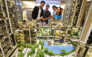 Potential buyers visit a sales office for a new development last month. A commentary in People’s Daily endorsed hard work as more important than property speculation. Photo: Dickson Lee