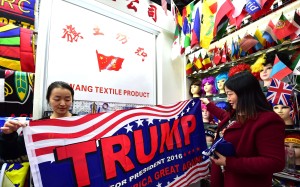 A shop assistant with a pro-Trump banner at the China Yiwu International Trade City. Photo: AFP