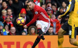 Wayne Rooney crosses for Manchester United in their 1-1 draw with Arsenal. Photo: AFP